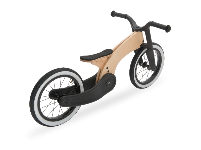 50's design balance bike wooden and recycled. White walls 